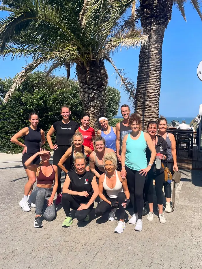 A Velocity class group photo under the palms